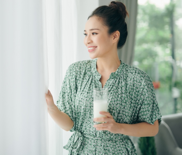 woman drinking yoghurt